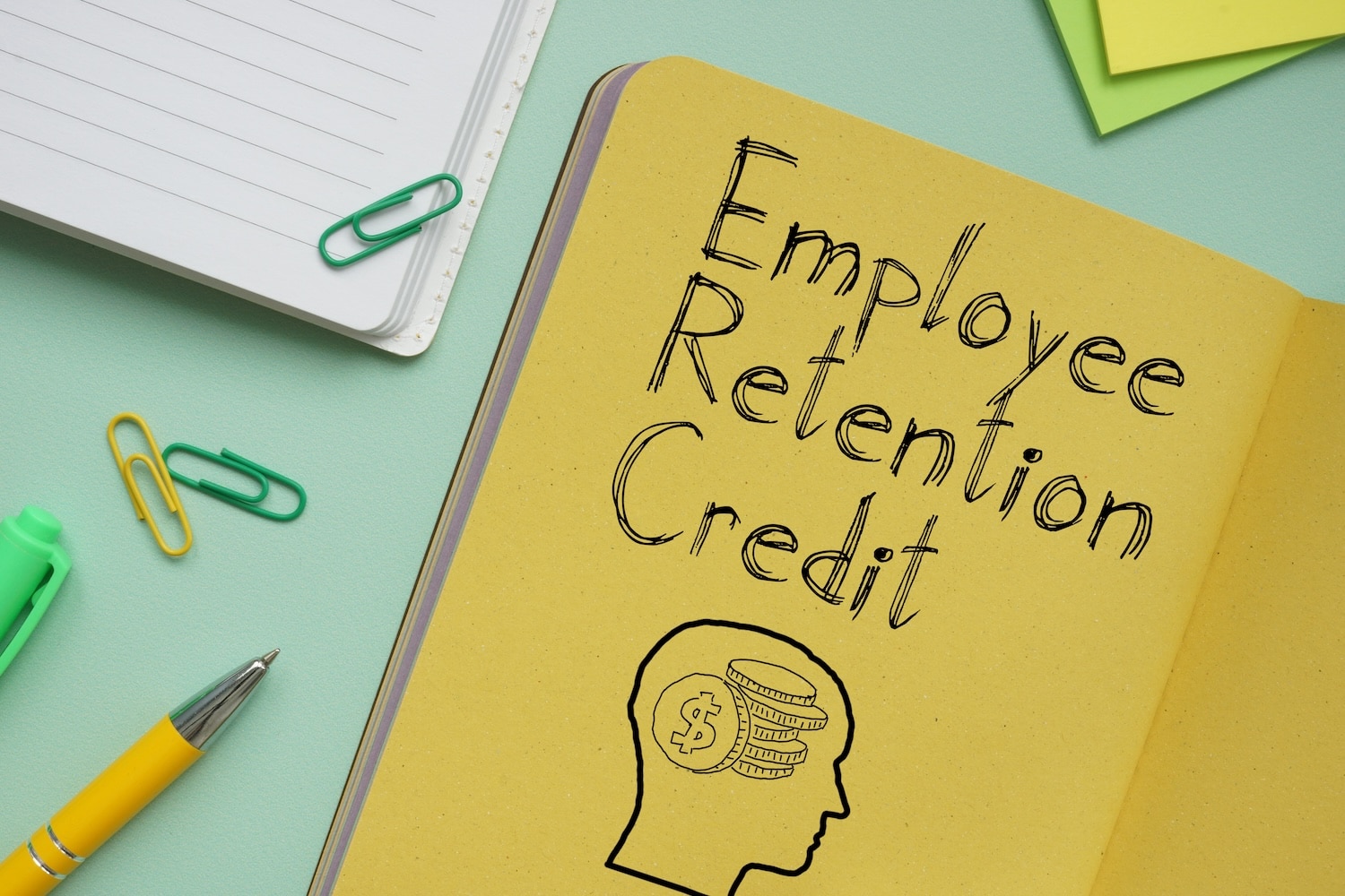 Employee Retention Credit ERC is shown on a business photo using the text