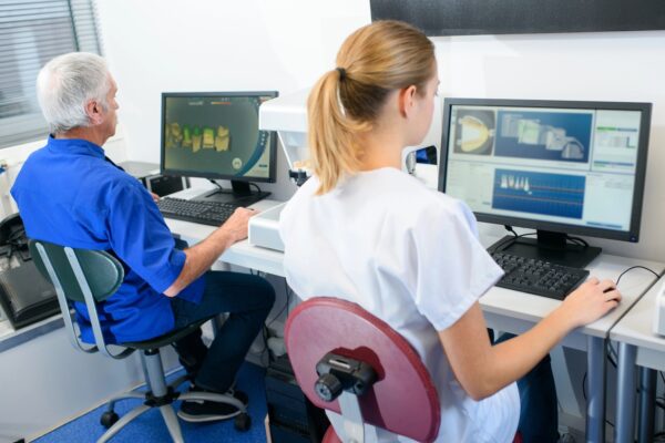 dentists working on computer