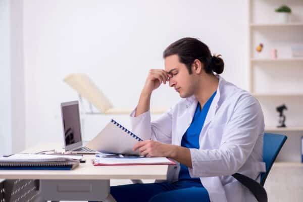 frustrated dentist at desk