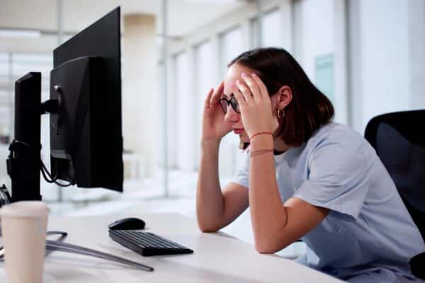 Frustrated dentist at computer