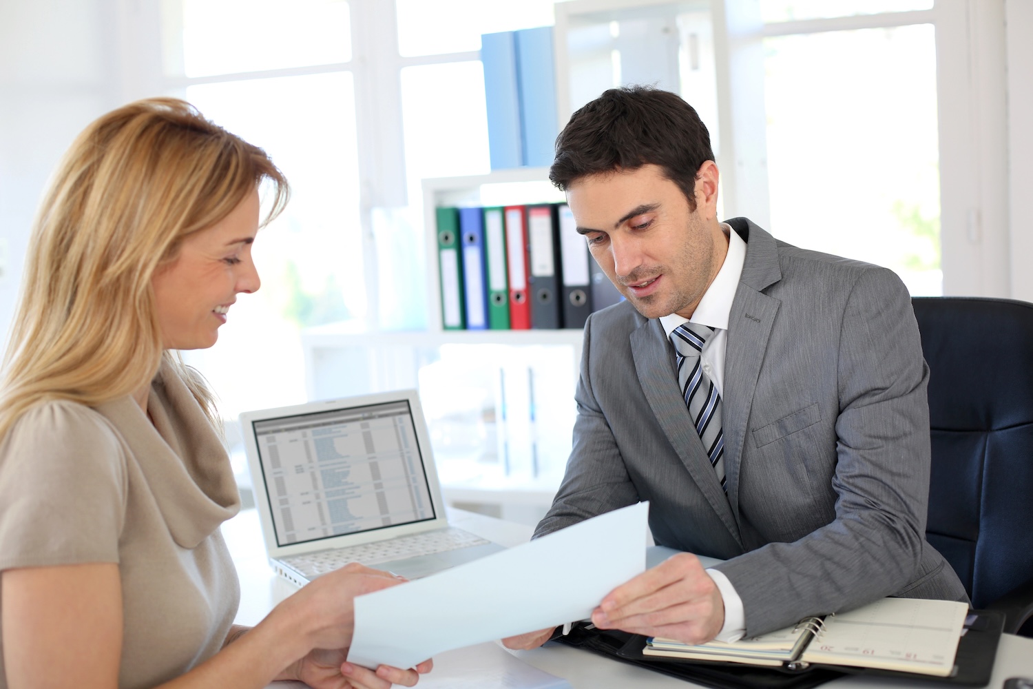 Dentist meeting with banker about loan