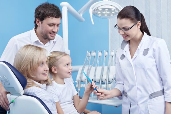 happy dental employees with patients
