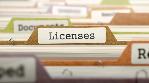 Licenses on Business Folder in Multicolor Card Index. Closeup View. Blurred Image.