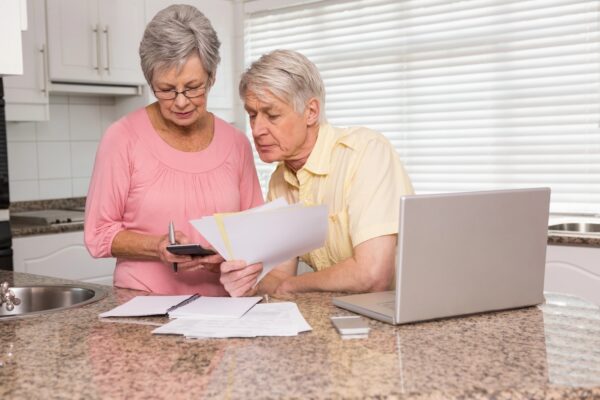 Senior couple planning retirement contributions