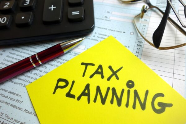 tax planning on yellow post-it on desk