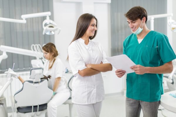 dentists discussing payroll in office