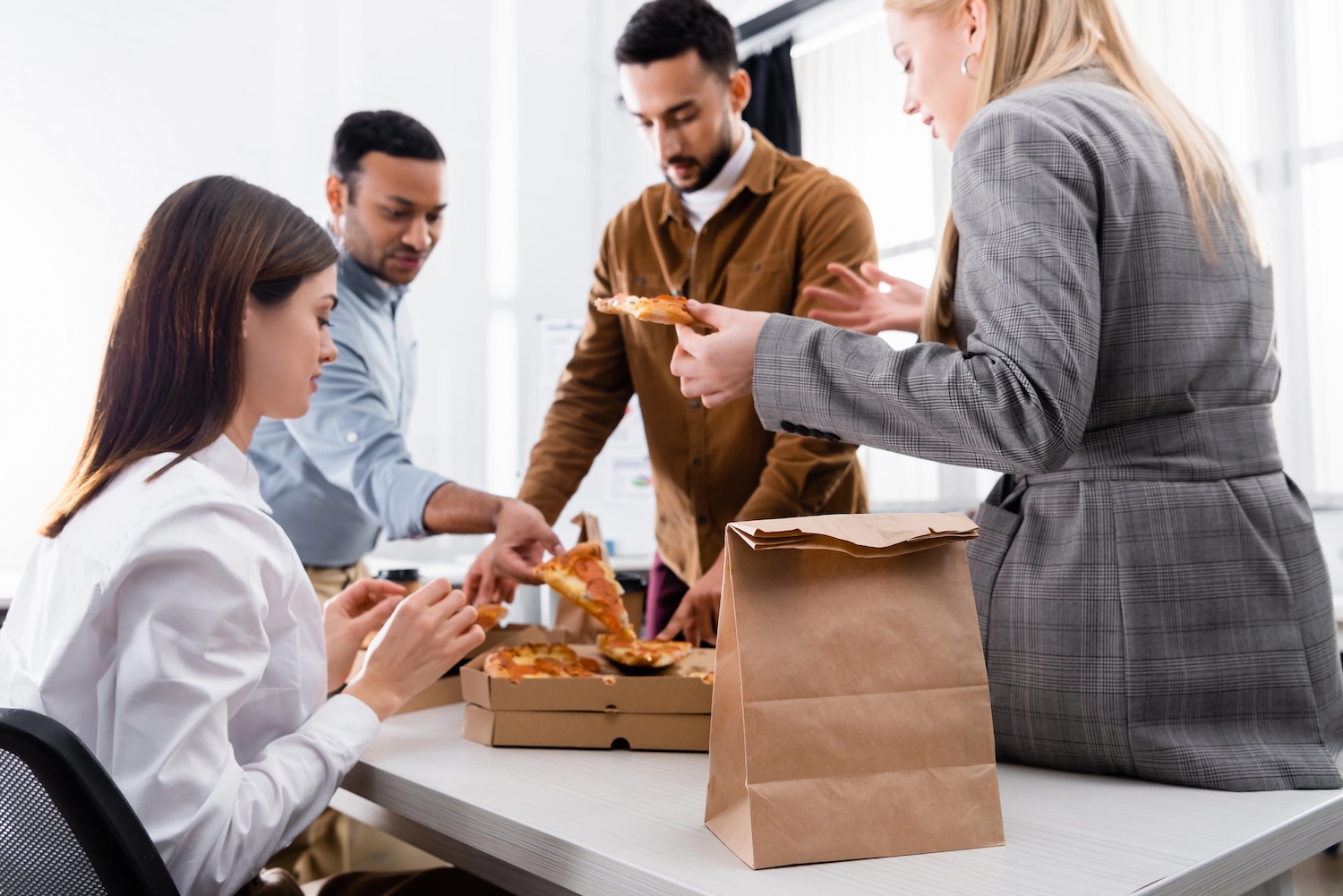 Dental office employees enjoying employer supplied lunch