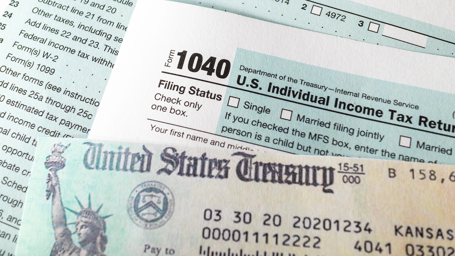 Check, tax return check and 1040 Form.