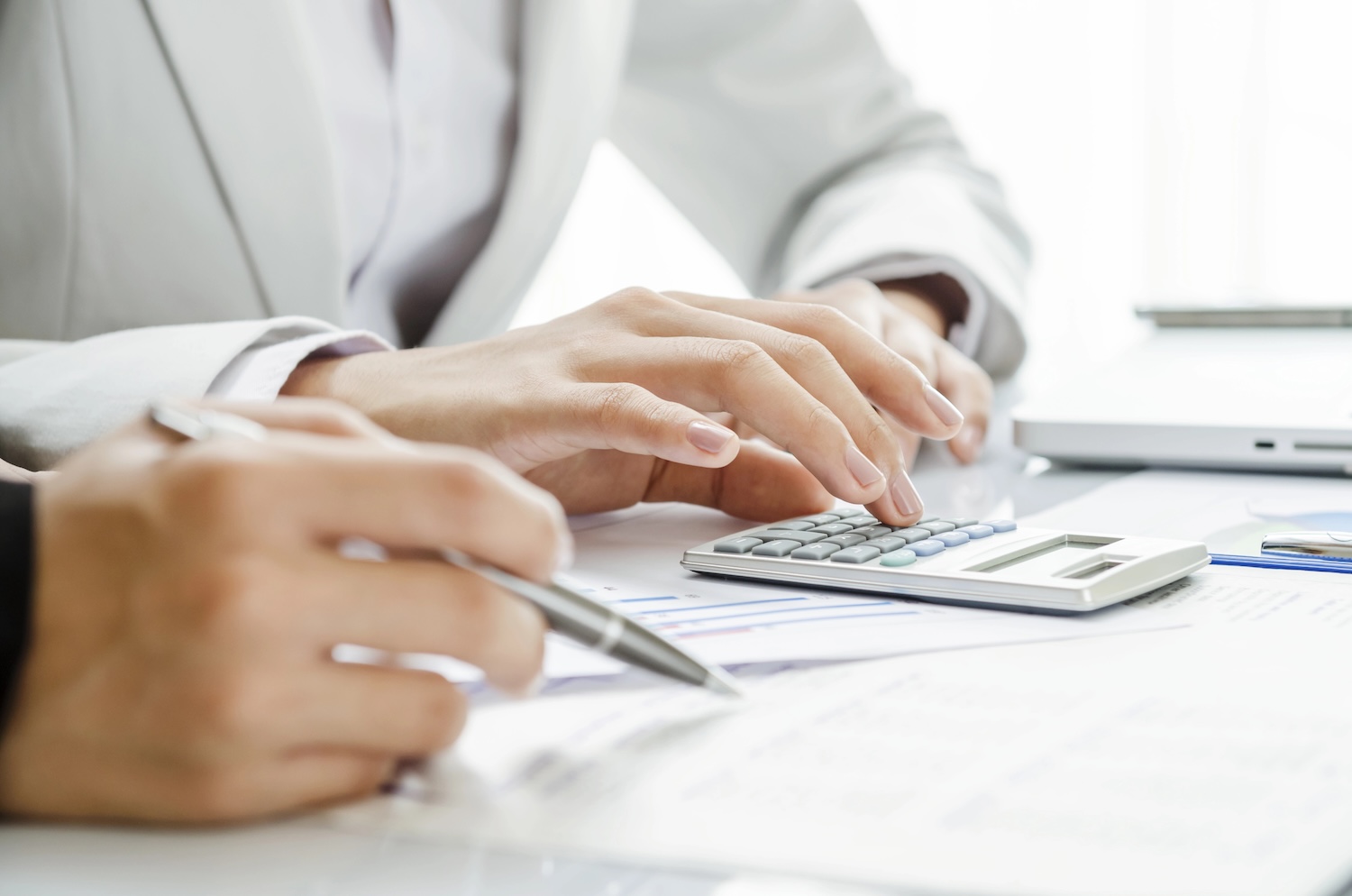 Dentist crunching numbers to make an important decision