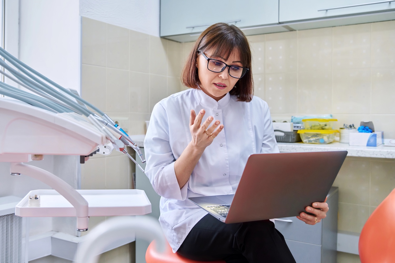 Dentist working on a computer in her office