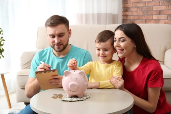 family with child and piggy bank